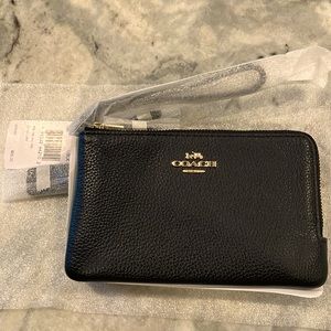 Coach wristlet/wallet.  BRAND NEW with tags. Black pebble leather.